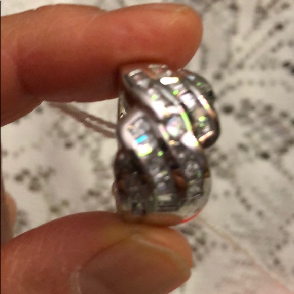 Ring Made of 9/5 Silver; and imitation diamond.